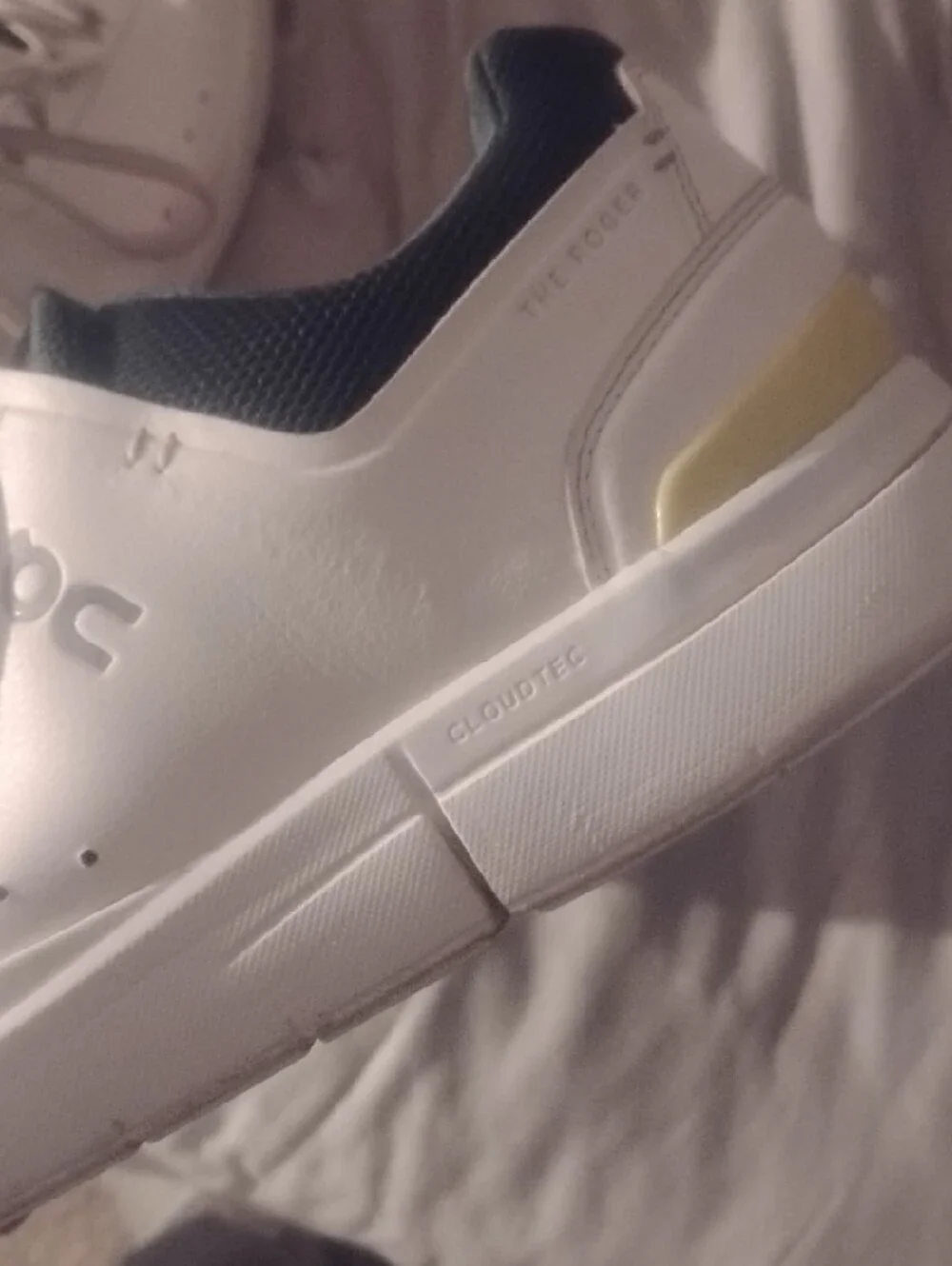 On Running The Roger Navy And White With Yellow Accents Size 11.5